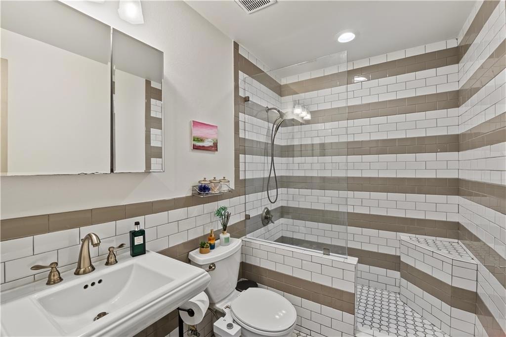 Updated bathroom with tiled walk-in shower